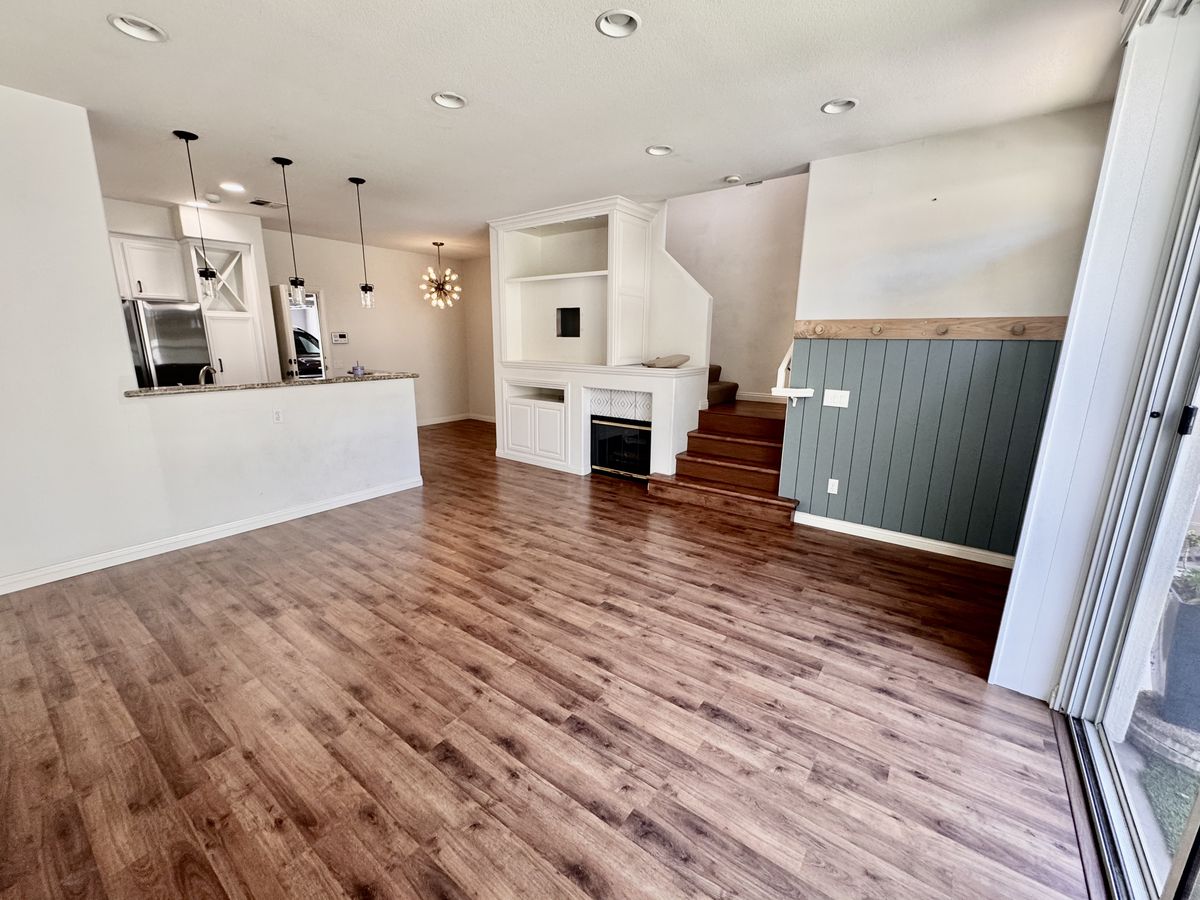 Living and dining area with fireplace and open kitchen