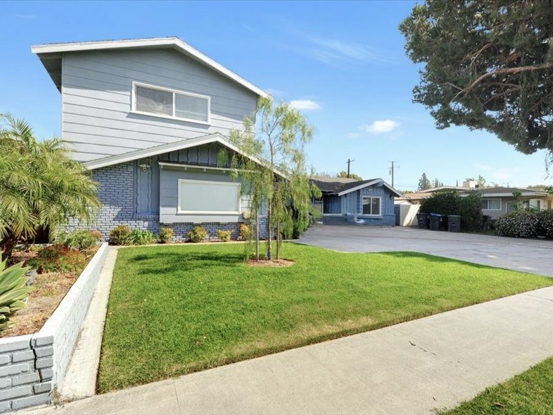 Street view showing the lawn and driveway